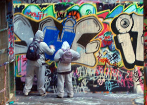 Graffiti artists at work on the South Bank